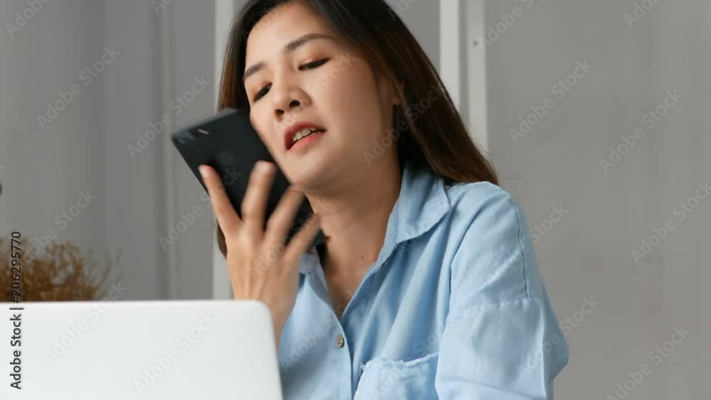 Young asian business owners using computer pc and smart phone at home office. Young asian business owners using computer pc and smart phone at home office.