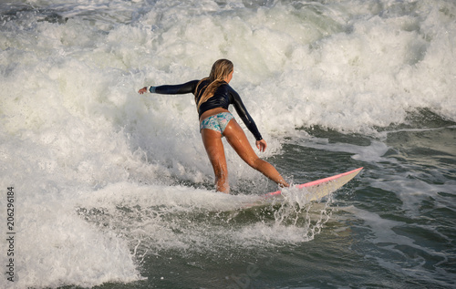 unknown surfer rides a wave