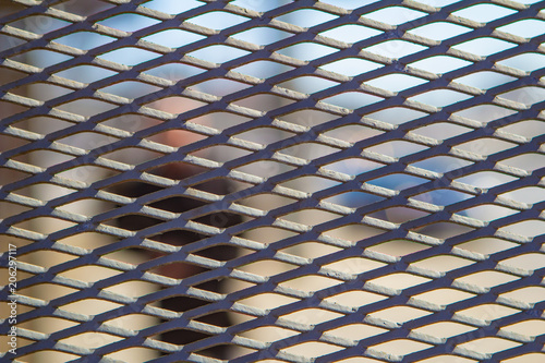 diamond grid pattern metal fence photo