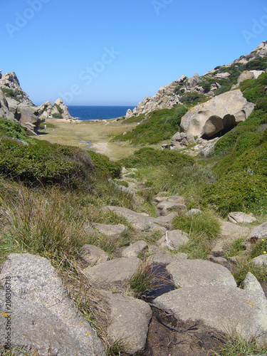 Blue sky and amazing sea, granite rocks with mediterranean vegetation, moon Valley, Valle della Luna, Capo Testa, Santa Teresa Gallura, Italy
