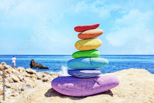 Photography Rainbow Rock Stack by the ocean on a sunny day