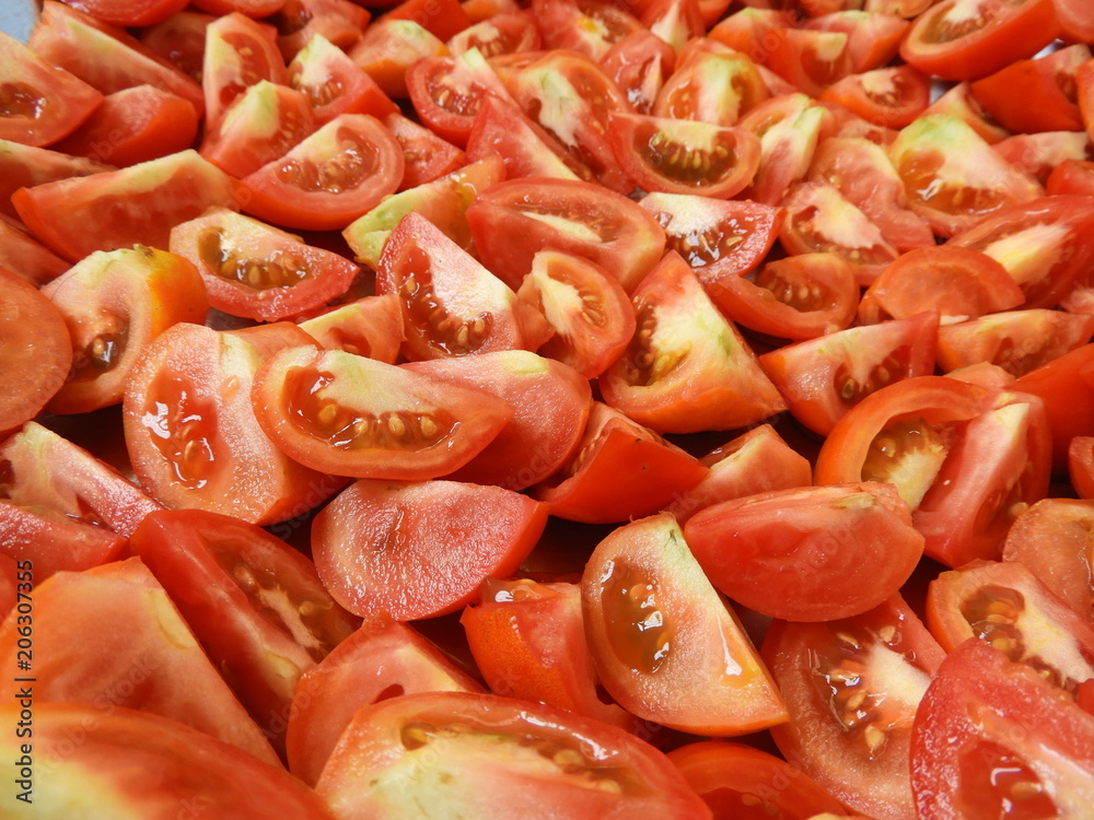 The red fresh tomatoes cut on a quarter