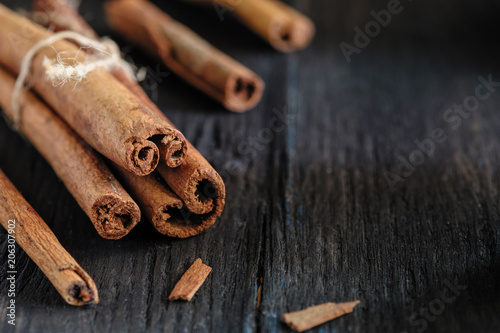 a cinnamon is spicy fragrant on a table with a mestome for a background