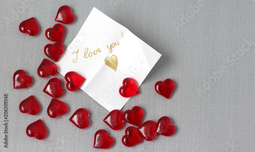 lots of red transparent hearts with a note I love you Valentine's Day photo