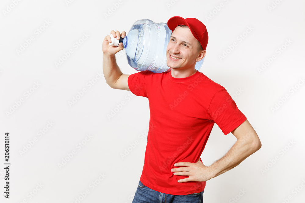 Content delivery courier or dealer man in red uniform carrying bottle of fresh water to office cooler isolated on white background. Professional happy male in cap t-shirt. Copy space for advertisement Content delivery courier or dealer man in red uniform carrying bottle of fresh water to office cooler isolated on white background. Professional happy male in cap t-shirt. Copy space for advertisement