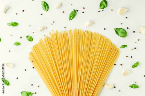 pasta, basil, garlic and pepper on a white background