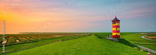 A beautiful lighthouse on the East Frisian coast photo