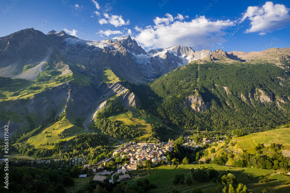 La Grave village with La Meije peak and glaciers in morning light. Ecrins National Park, Hautes-Alpes, French Alps, France La Grave village with La Meije peak and glaciers in morning light. Ecrins National Park, Hautes-Alpes, French Alps, France