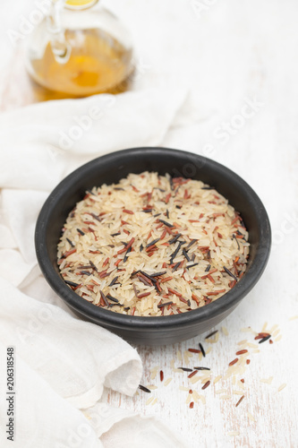 mix rice in small black bowl on white background