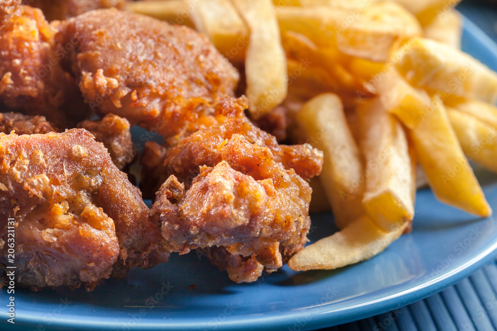 Crispy chicken karaage served with french fries Crispy chicken karaage served with french fries