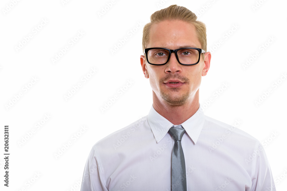 Studio shot of young handsome businessman wearing eyeglasses Studio shot of young handsome businessman wearing eyeglasses