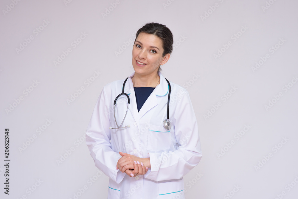 Portrait of a beautiful female doctor on a white background with an endoscope Portrait of a beautiful female doctor on a white background with an endoscope