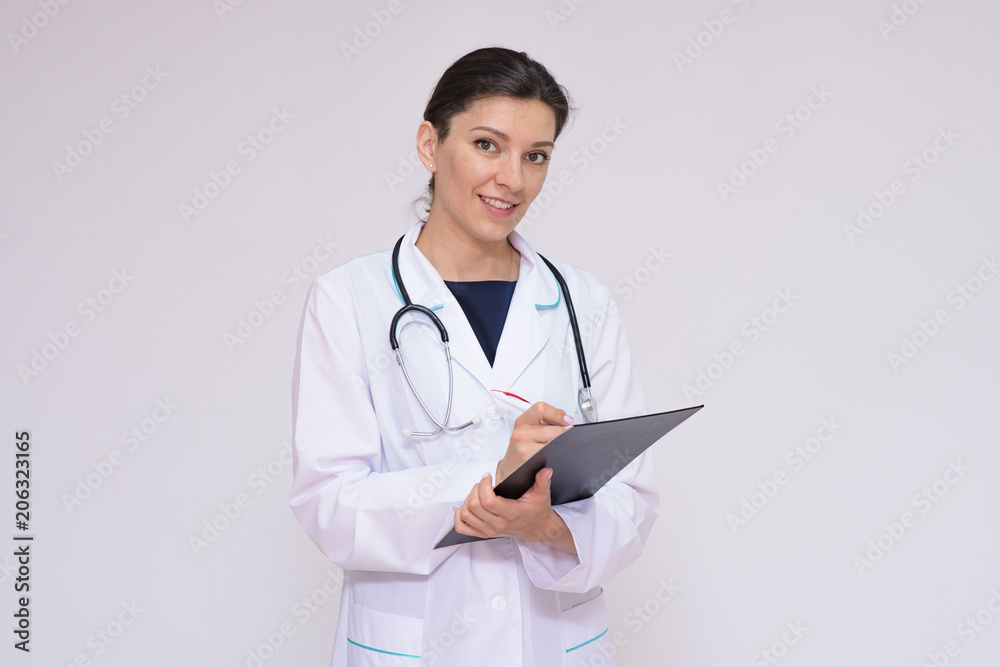 Portrait of a beautiful female doctor on a white background with an endoscope Portrait of a beautiful female doctor on a white background with an endoscope