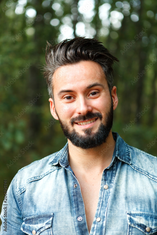 Fototapeta premium Young handsome bearded hipster man