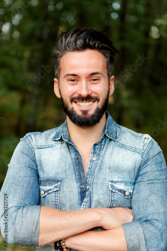 Young handsome bearded hipster man