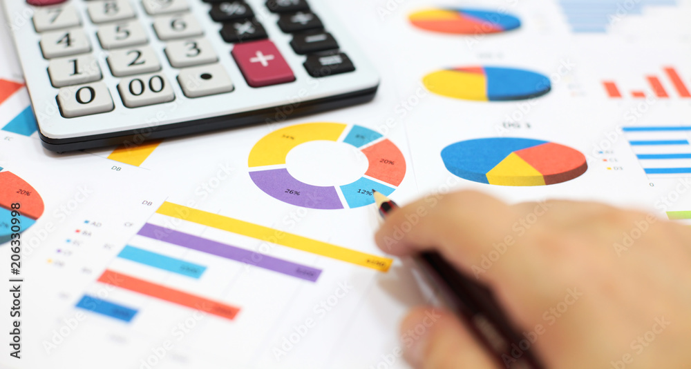 Business charts and graphs, calculator, pencil Business charts and graphs, calculator, pencil