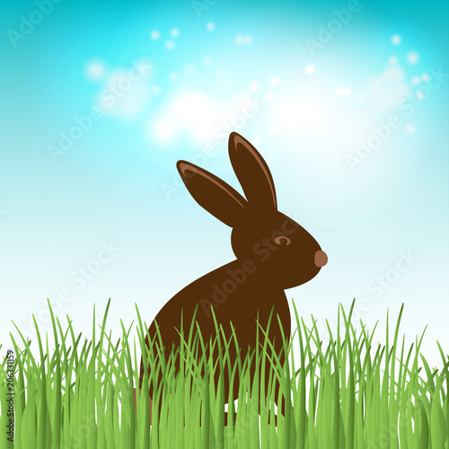 Brown Cute Chocolate bunny in grass. Vector easter illustration. © Maria Cherevan