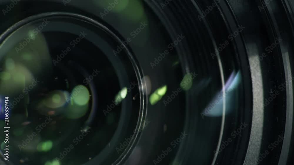 Security camera lens zooming in, close up. Private property protection and public surveillance concept.