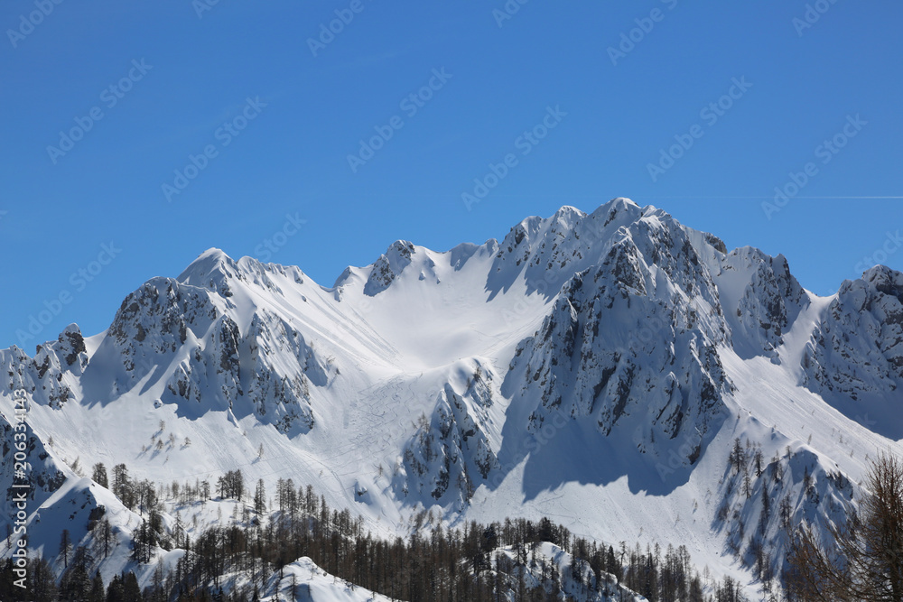 wide panormaric view of moutains with snow in winter from Lussar