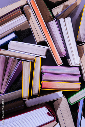 top view of scattered stack of books on table