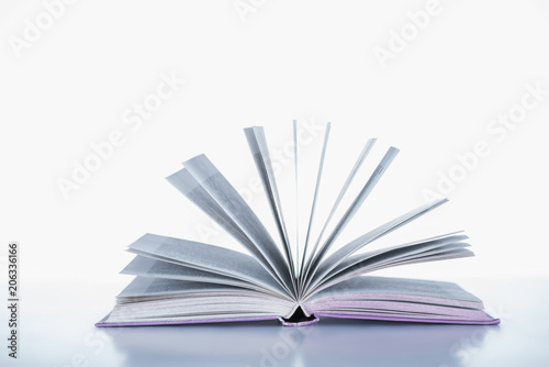 one open book on white surface