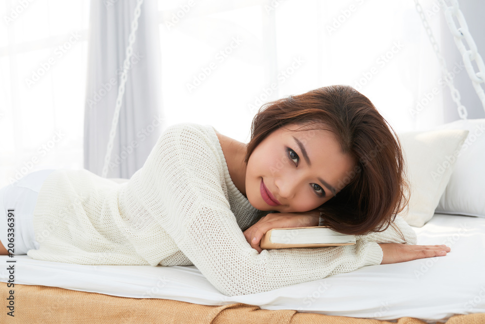 Attractive woman resting in bed