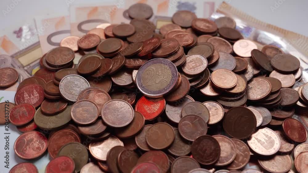 Many coins and bills, euros, money Many coins and bills, euros, money