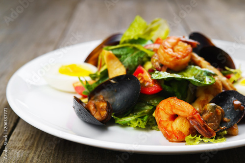Seafood salad with shrimps and mussels restaurant serving. Mediterranean food, appetizer, banquet, restaurant menu, dining concept