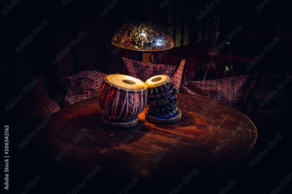Fototapeta premium ethnic musical instrument tabla in the interior of the chill-out