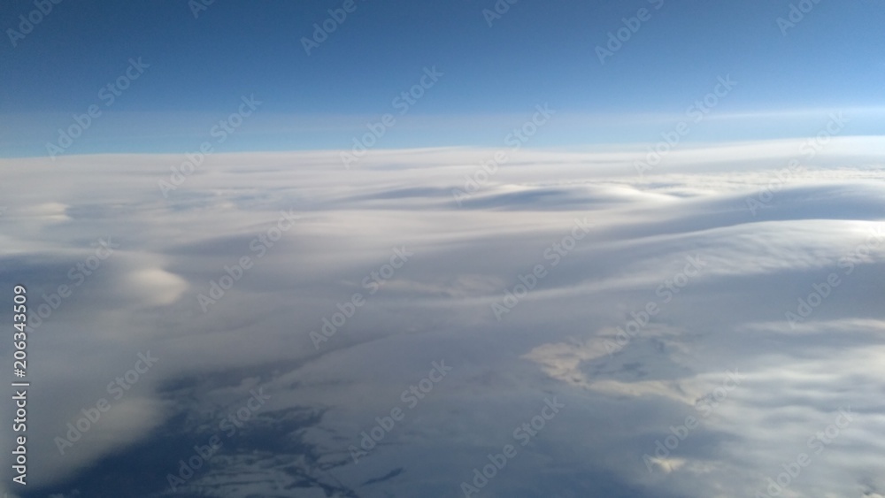 View from the airplane window: blanket from the cloud