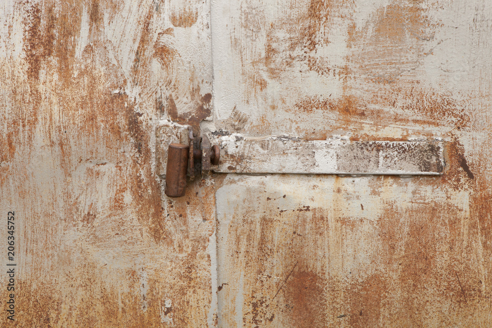 Old rusty padlock on the metal door Old rusty padlock on the metal door