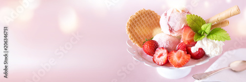 Sundae with strawberries and waffle photo