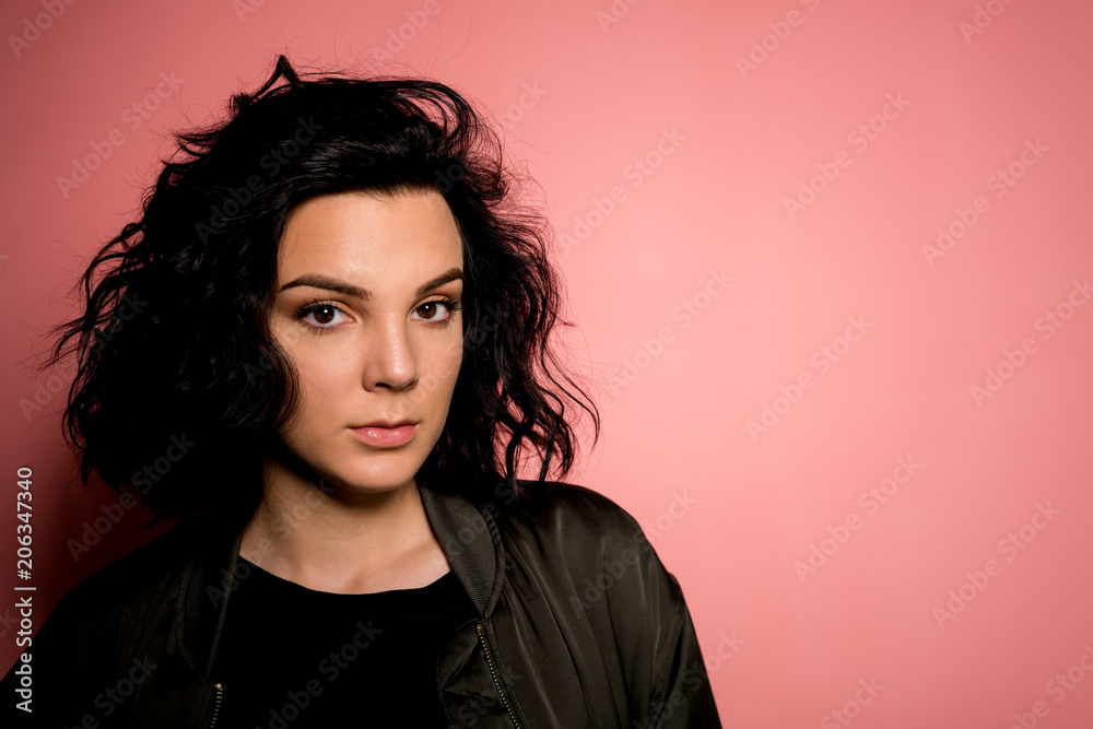 Young women on pink background Young women on pink background