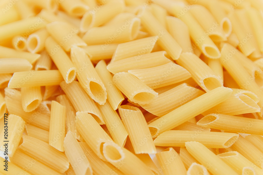 heap of raw pasta. top view. background. close up. italian food or cuisine heap of raw pasta. top view. background. close up. italian food or cuisine