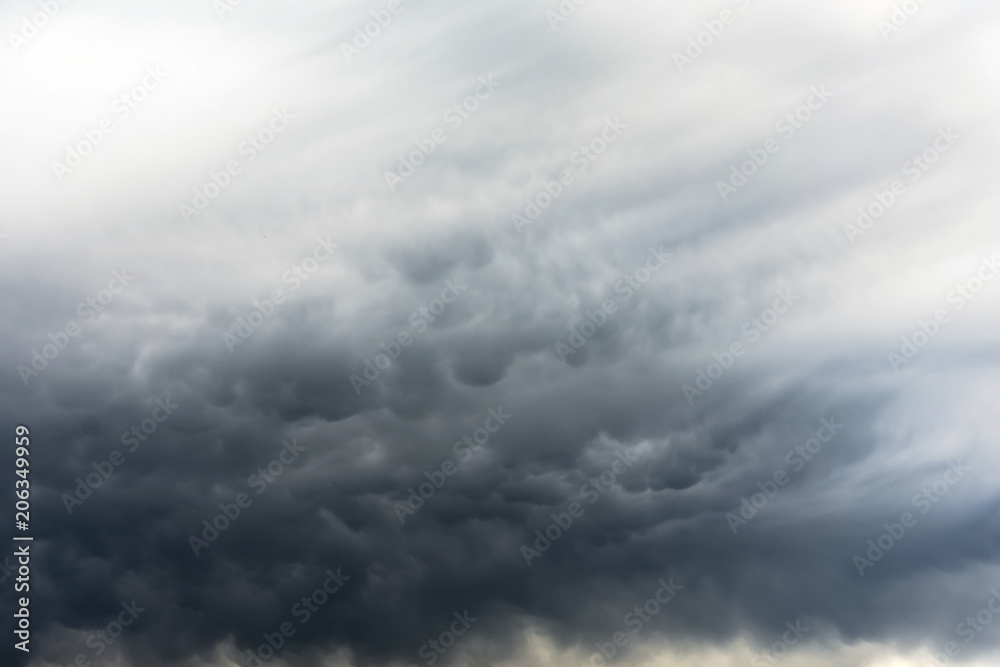 Mammatus clouds fill the sky after a passing supercell thunderstorm.