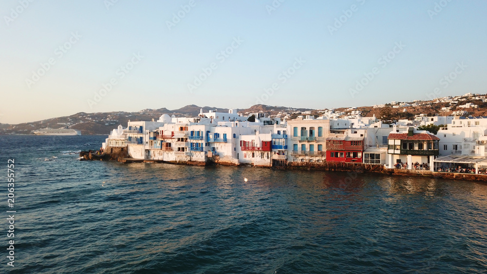 Aerial drone, bird's eye view photo from iconic Little Venice at sunset with beautiful colours, Mykonos island, Cyclades, Greece