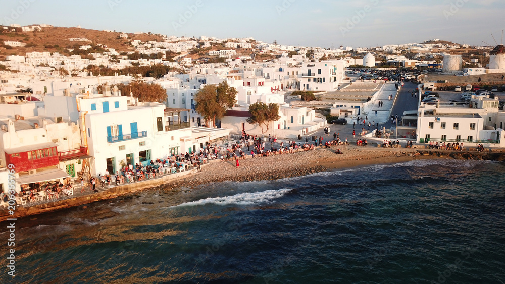 Aerial drone, bird's eye view photo from iconic Little Venice at sunset with beautiful colours, Mykonos island, Cyclades, Greece