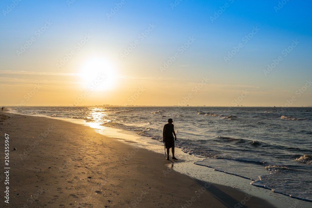 Man Walking on Beach