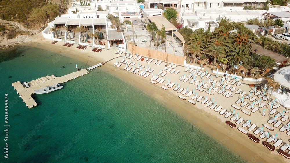  Aerial drone photo of famous turquoise clear water beach of Psarou in iconic island of Mykonos, Cyclades, Greece
