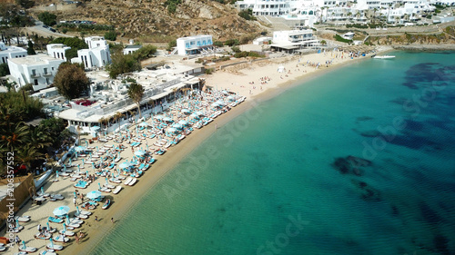 Fototapeta Naklejka Na Ścianę i Meble -  Aerial drone photo of famous turquoise clear water beach of Psarou in iconic island of Mykonos, Cyclades, Greece