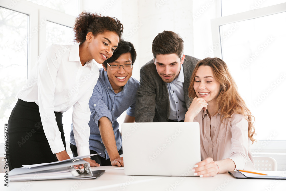 Group of smart young multiethnic businesspeople