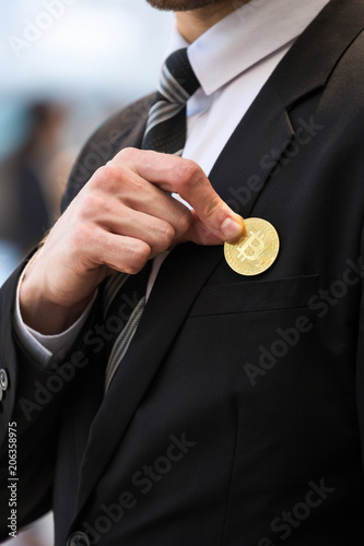 Golden bitcoin in hand