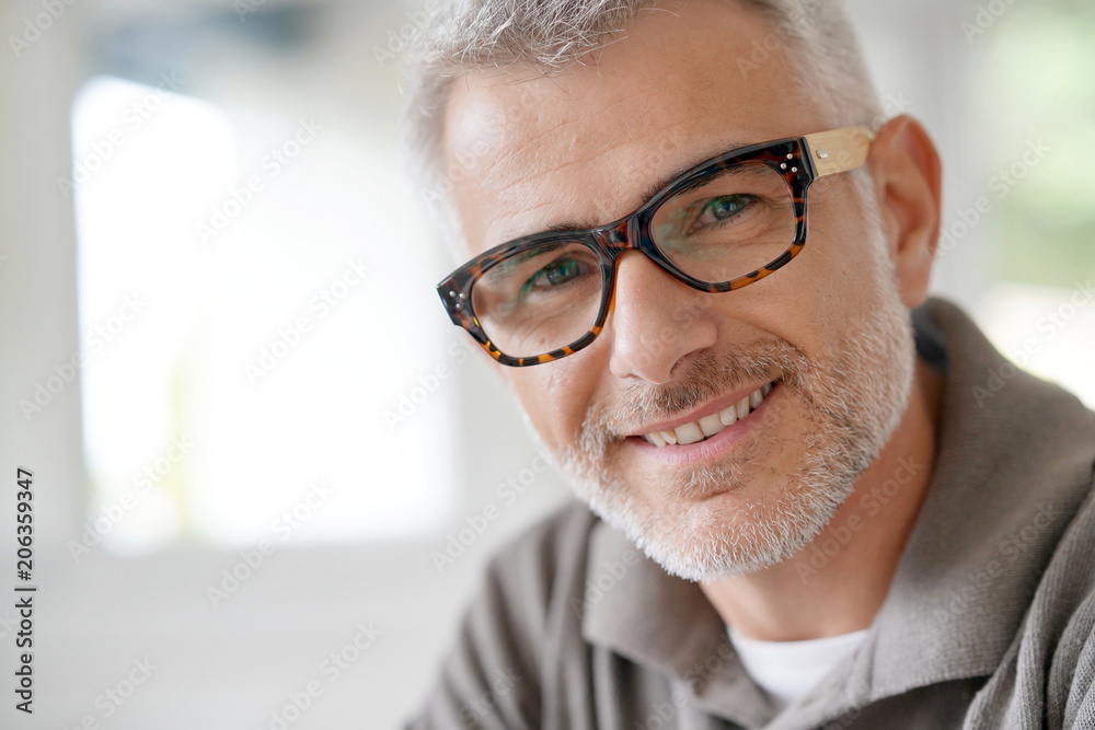 Portrait of smiling middle-aged man with eyeglasses Portrait of smiling middle-aged man with eyeglasses