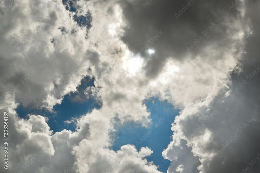 Soon a thunderstorm. The storm clouds and clouds, and in the gaps you can see the blue sky. anxious waiting. Soon a thunderstorm. The storm clouds and clouds, and in the gaps you can see the blue sky. anxious waiting.