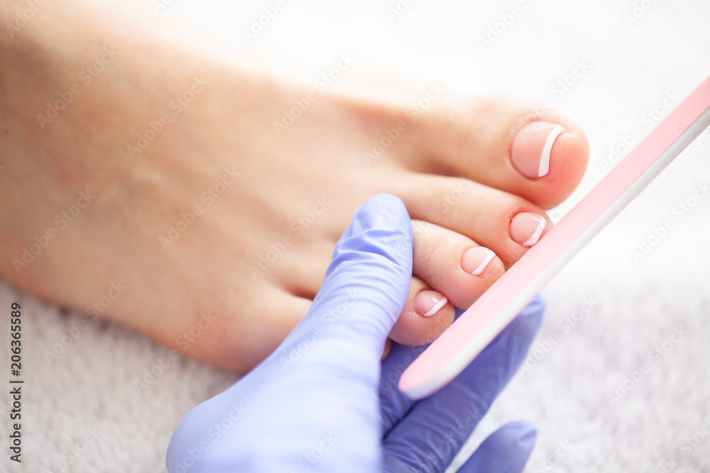 Closeup Photo of a Female Feet at Spa Salon on Pedicure Procedur.Care. Beautiful Women's Feet with Pedicure in Beauty Salon. Spa Manicure. Closeup Photo of a Female Feet at Spa Salon on Pedicure Procedur.Care. Beautiful Women's Feet with Pedicure in Beauty Salon. Spa Manicure.