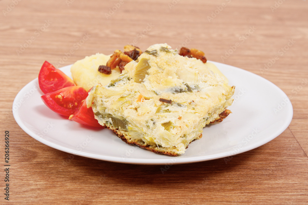 Baked leek with mashed potatoes on a table Baked leek with mashed potatoes on a table