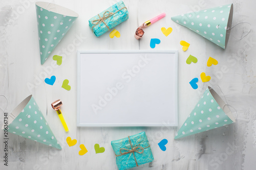 A frame with gifts, hats for birthday parties, and congratulations. With an empty space for the inscription