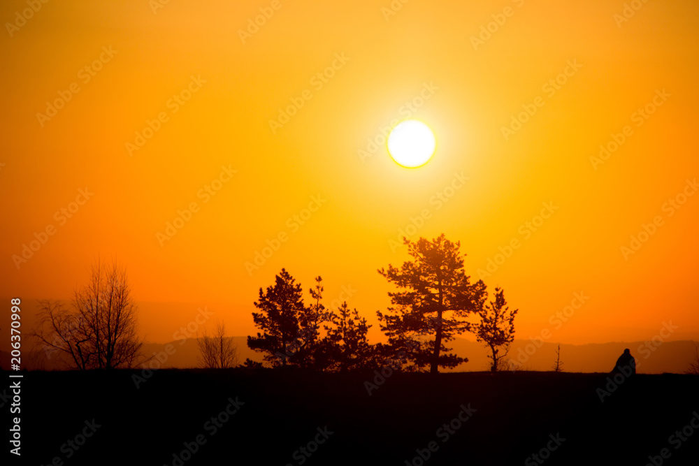 A traveler meets the dawn in the mountains of the Caucasus. A traveler meets the dawn in the mountains of the Caucasus.
