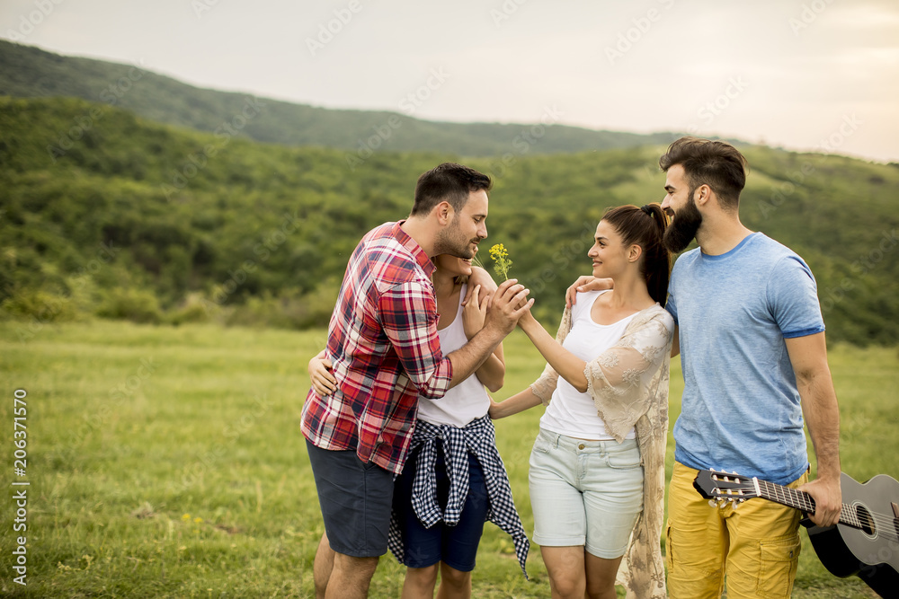 Group od young people having fun on a trip in nature