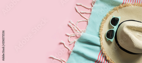 Vászonkép Straw beach sunhat and sun glasses on punchy pink with space for text